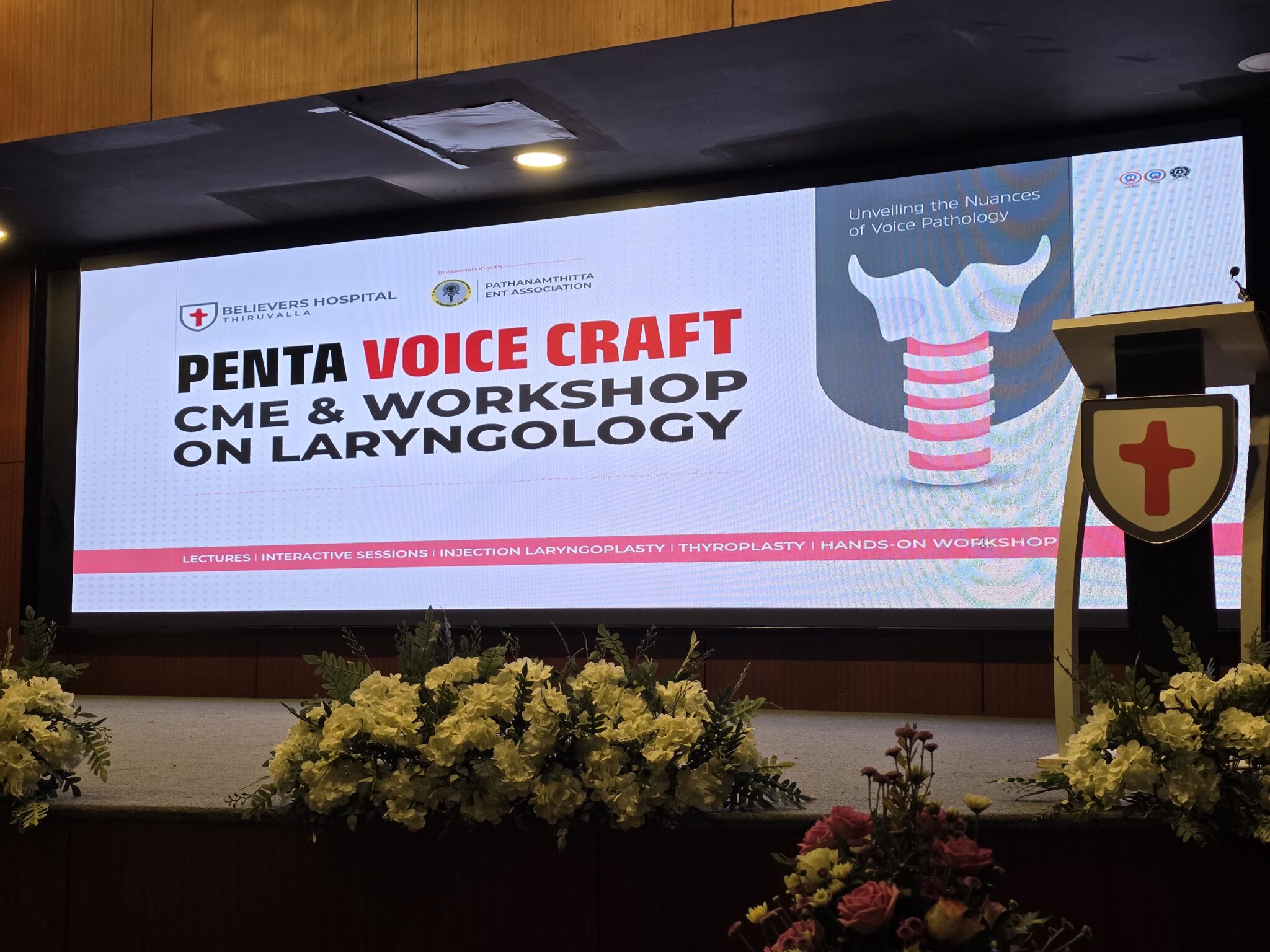 Venue setup for the PENTA Voice Craft event, featuring stage, seating arrangements, and event branding