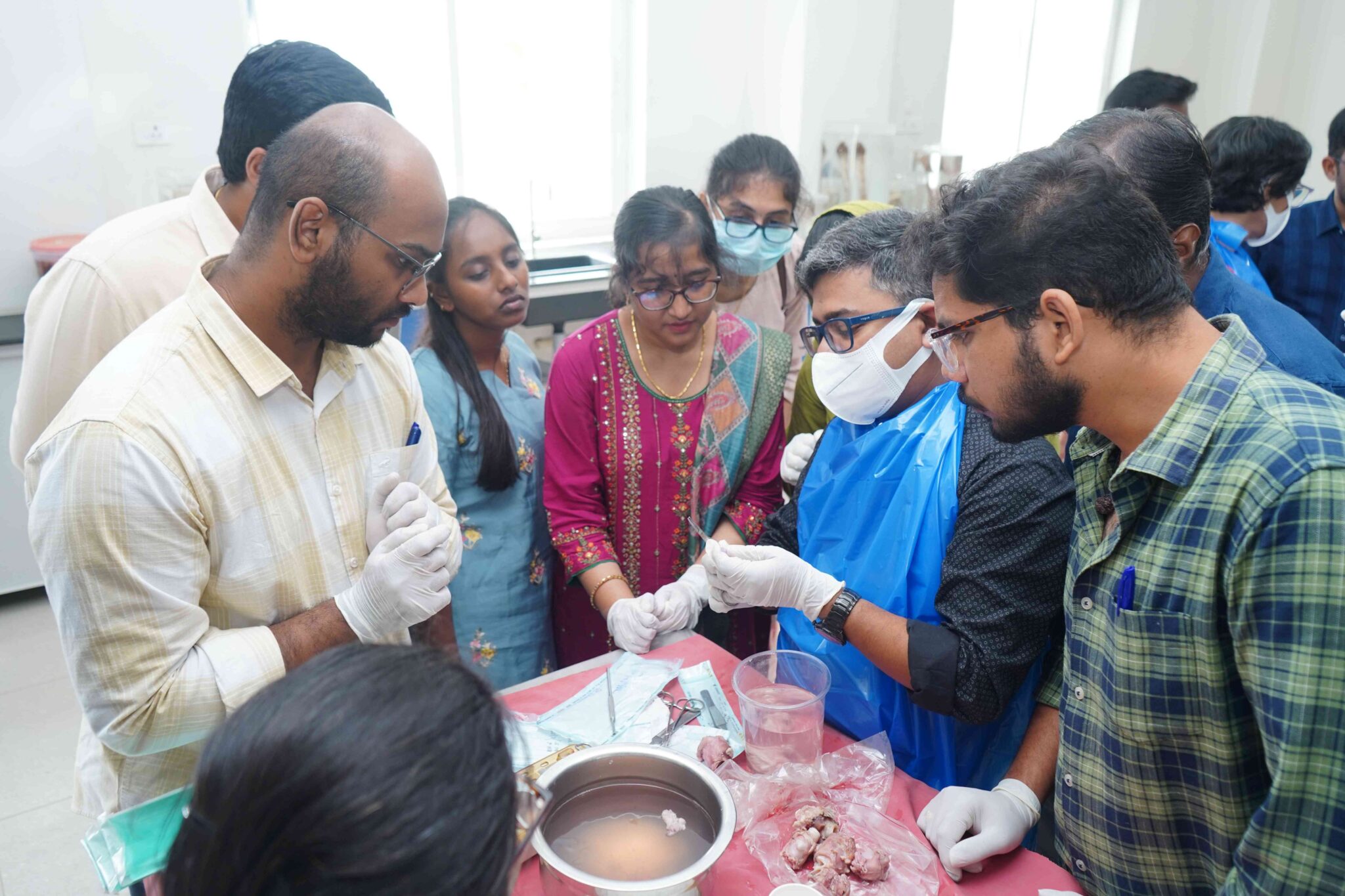 Dr. Sabari Nath demonstrating the anatomical landmarks for injection laryngoplasty using a goat larynx model